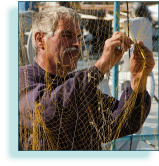 Fisherman mending nets, Chania, Crete, Greece
